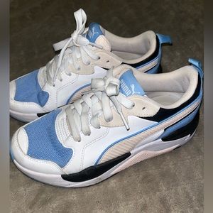 Women’s PUMA X Ray Game shoes. They are blue,pastel pink, black & white color.